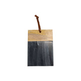 Wooden and black marble cutting board with a leather strap on a white background