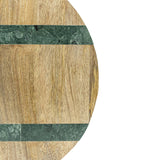 Round wooden cutting board with green marble inlay on a white background