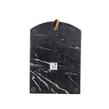 Black marble cutting board with brown handle on a white background