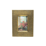 Decorative gold frame with a small painting inside on a white background