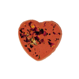 Heart-shaped orange bath bomb with floral petals on a white background