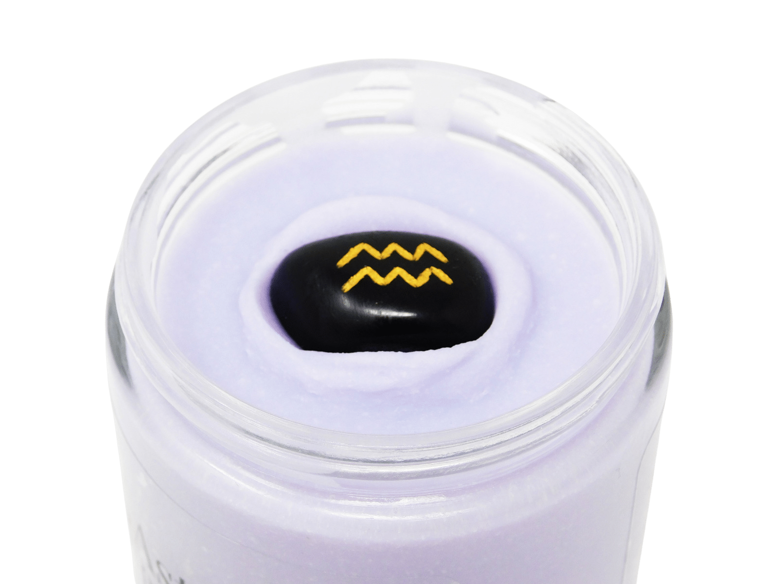 Astrology body cream with a black stone featuring a yellow logo on a black background