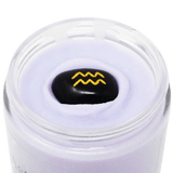 Astrology body cream with a black stone featuring a yellow logo on a black background