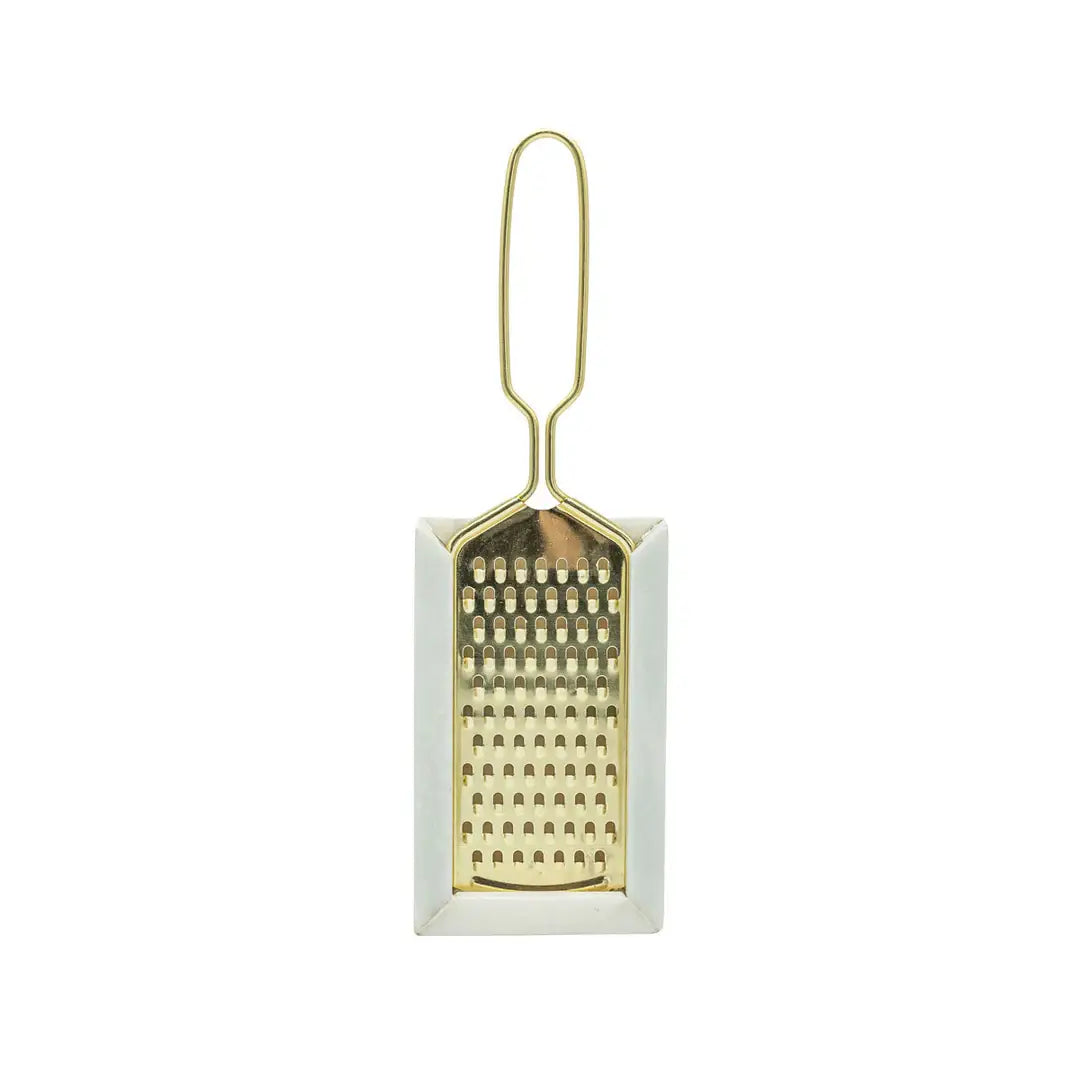 Small gold grater on a white background