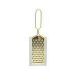 Small gold grater on a white background