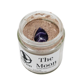 Jar of 'The Moon' herbal meditation ash with a purple crystal on a white background