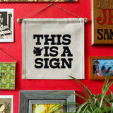 This is a Sign- Small Wall Banner