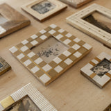 Collection of decorative picture frames on a textured surface