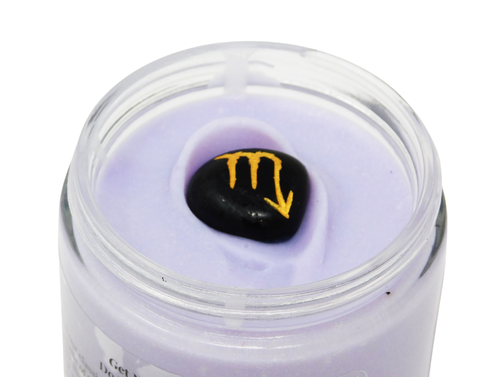 Jar of purple cream with a black stone featuring a yellow symbol on a white background