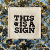 This is a Sign- Small Wall Banner