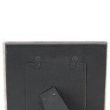 Back view of a picture frame with mounting hardware on a white background