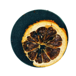 Dried orange slice on a black background