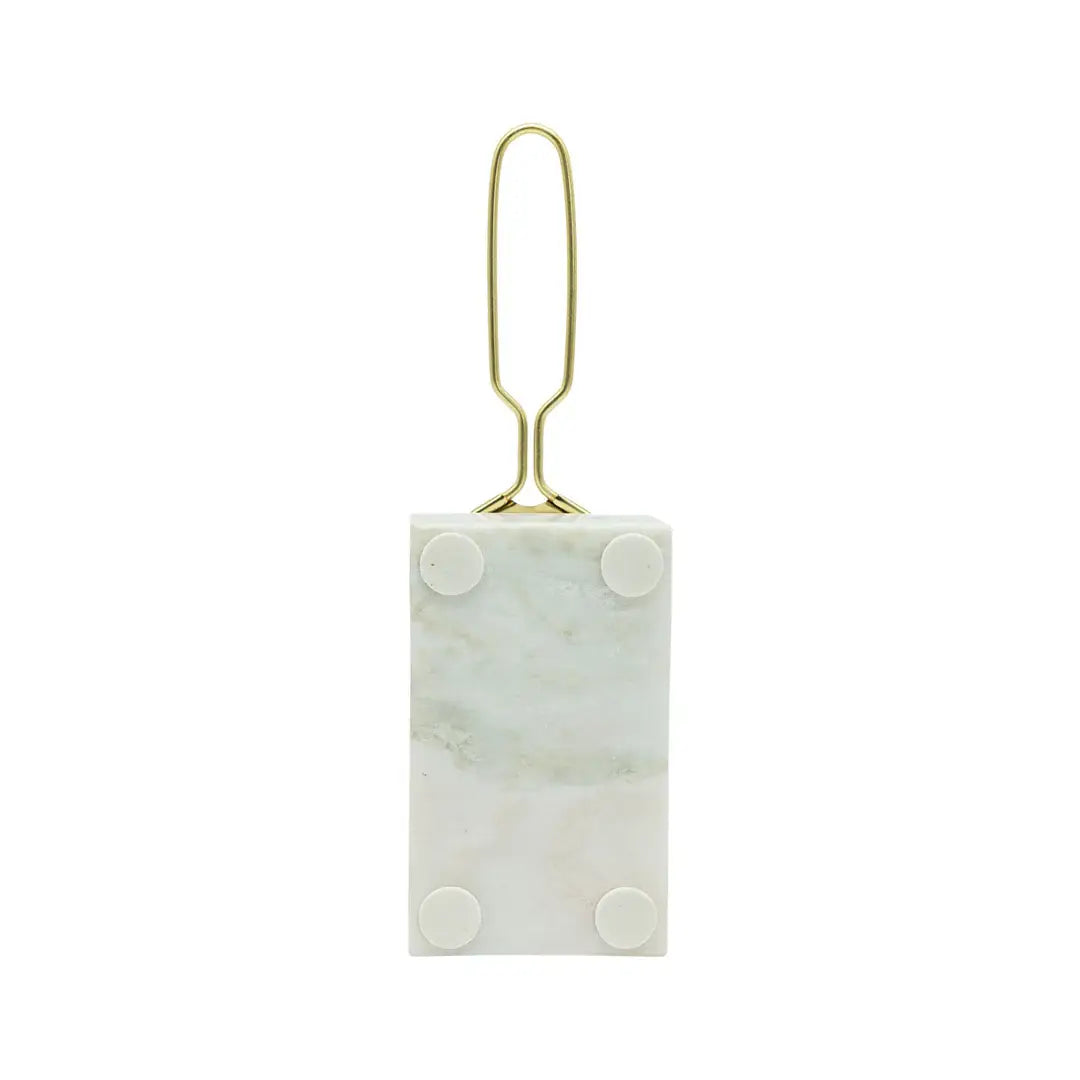 Marble-textured rectangular object with gold clip on a white background