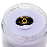 Cosmetic container with a purple lid featuring a logo on a white background