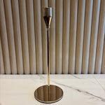 Small Gold Taper Candle Holder with a metallic finish on a marble surface