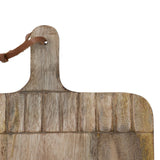Wooden cutting board with a leather handle on a white background