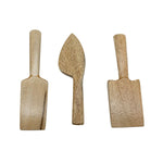 Three wooden kitchen utensils on a white background