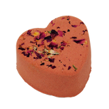 Heart-shaped bath bomb with floral petals on a white background