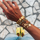Gold bracelets with black adjustable cord
