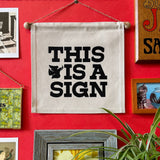 This is a Sign- Small Wall Banner