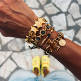 Gold bracelets with black adjustable cord