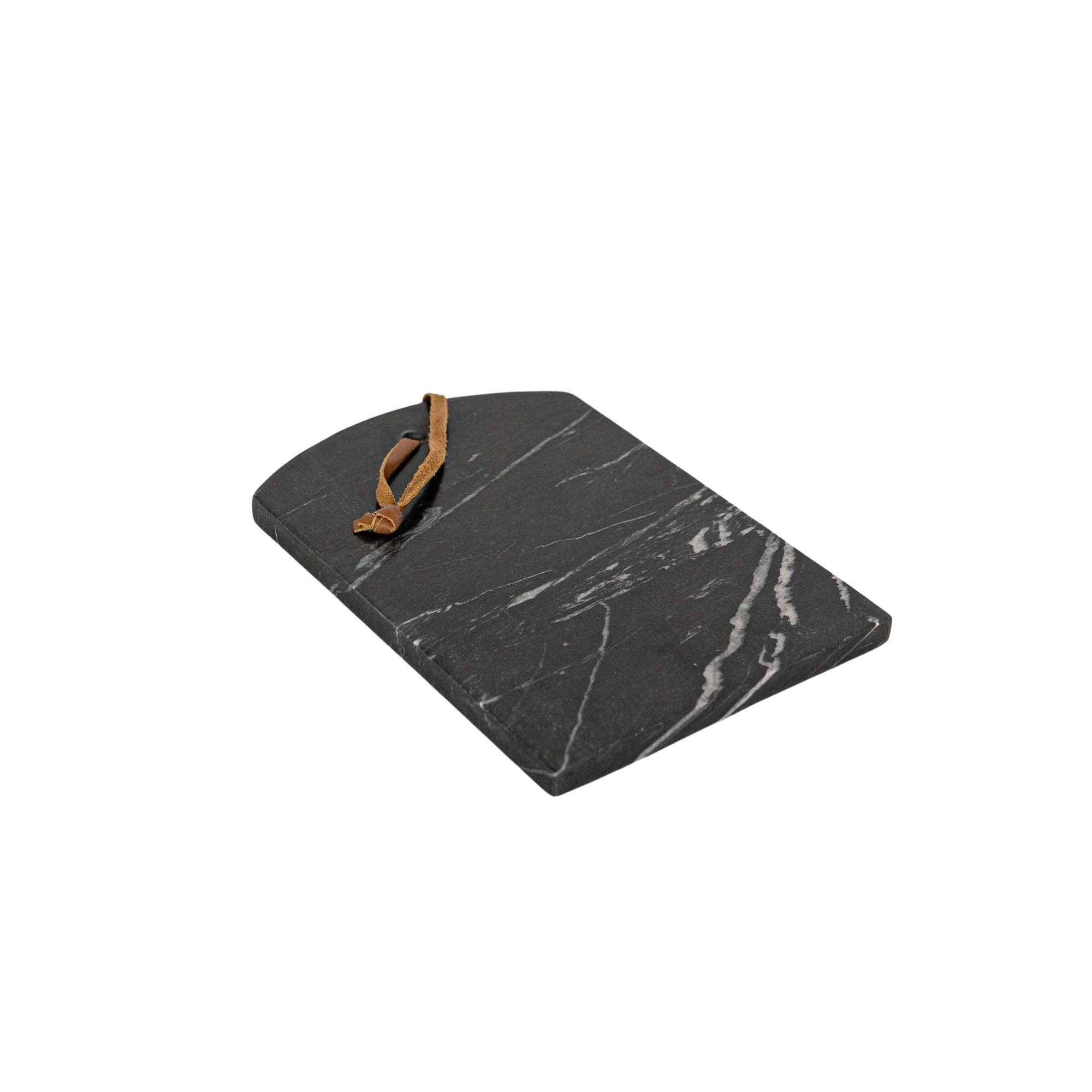 Black marble cutting board with a brown handle on a white background
