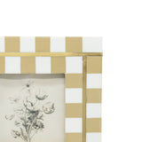 Decorative frame with gold and white checkered pattern and botanical illustration.