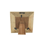 Wooden picture frame with a brown mat on a white background